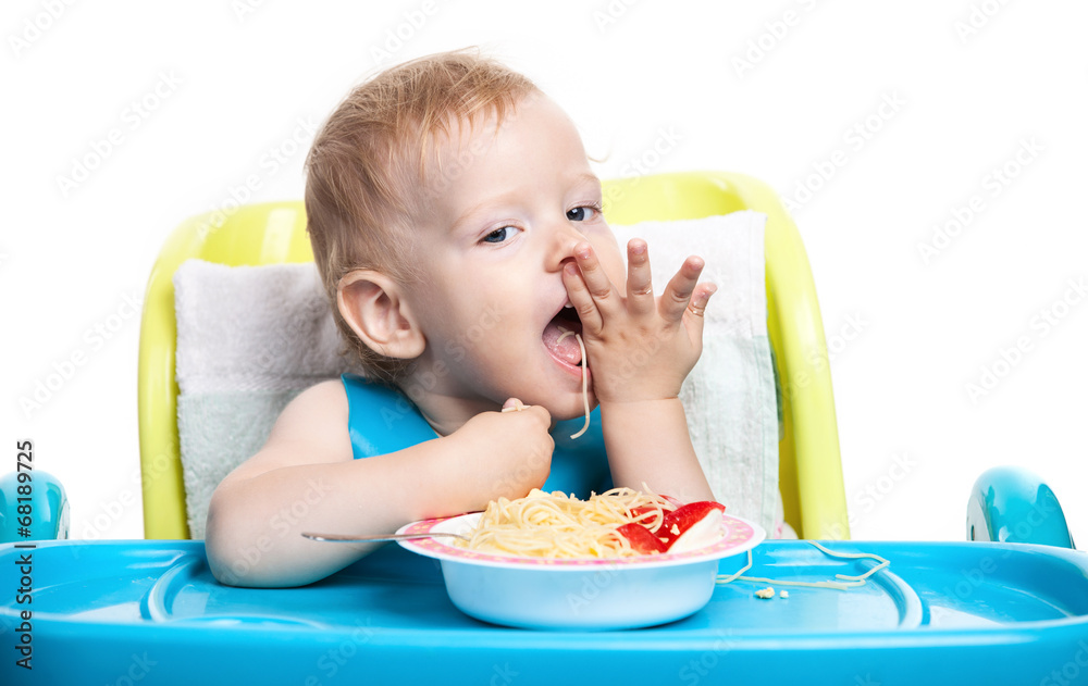 Little blond boy eating spaghetti Little blond boy eating spaghetti