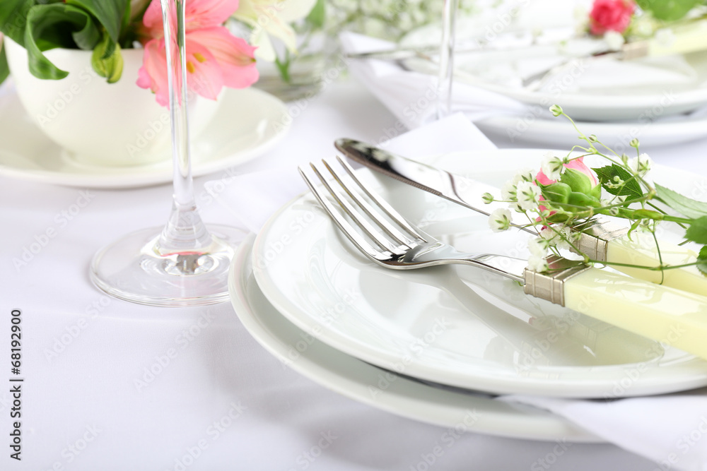 Table setting with spring flowers close up Table setting with spring flowers close up