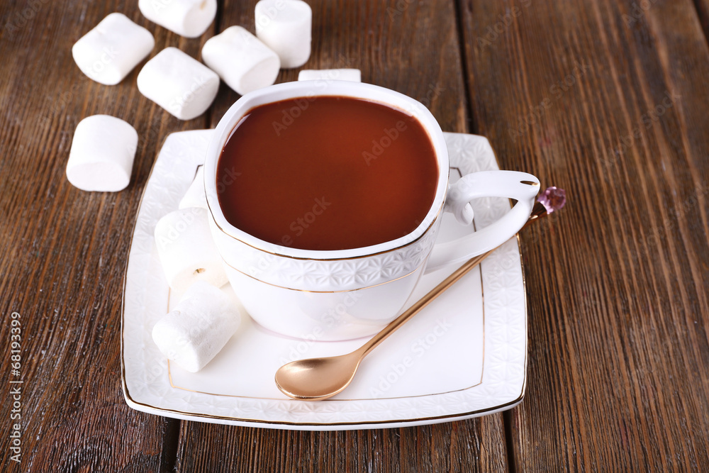 Obraz premium Cup of hot chocolate on table, close up