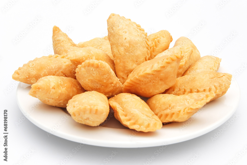 sweet fried dumpling for Chinese New Year on white sweet fried dumpling for Chinese New Year on white