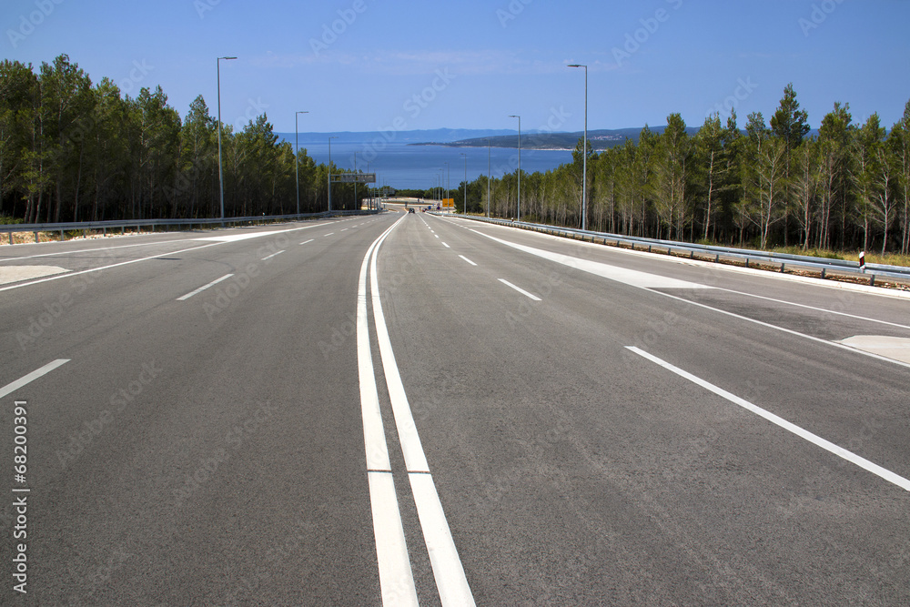 Fototapeta premium Four lane road from Biokovo mountain to Adriatic coast