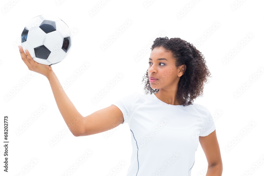 Pretty football fan in white holding ball Pretty football fan in white holding ball