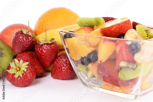 Wallpaper Mural Fresh fruits salad in bowl with fruits and berries close up Torontodigital.ca