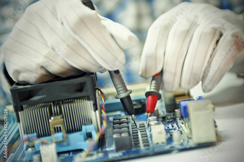 Man fixing mother board