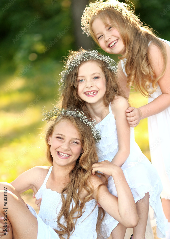 Portrait of two young girlfriends with flowers Portrait of two young girlfriends with flowers