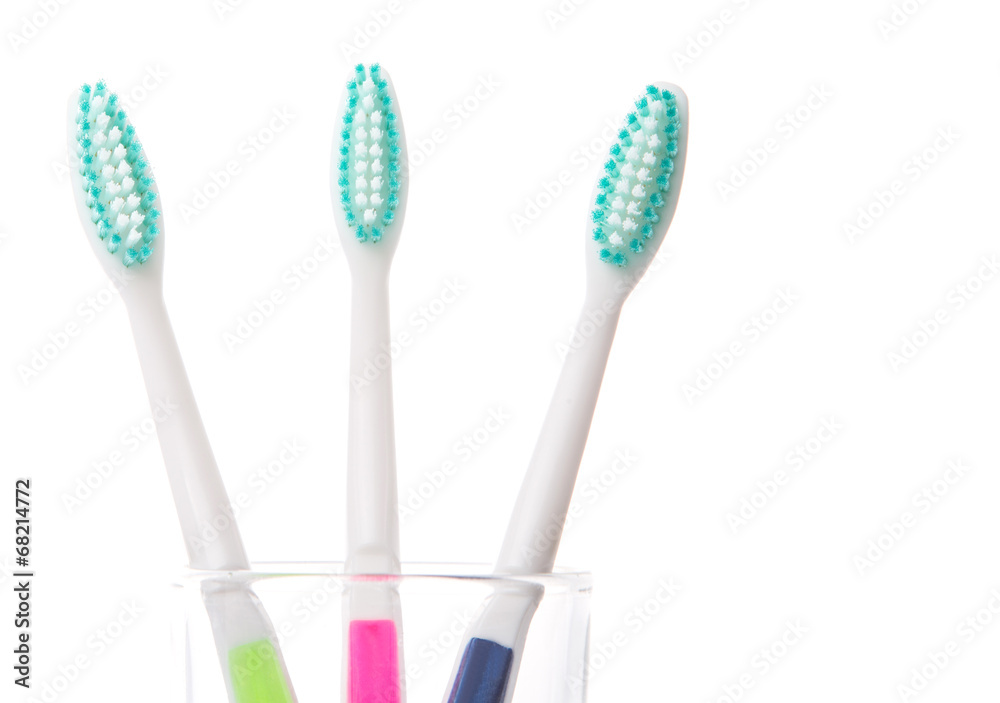 Tooth brush in a glass over white background Tooth brush in a glass over white background
