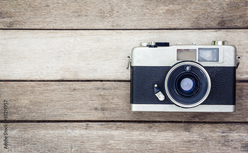 vintage camera in wood background