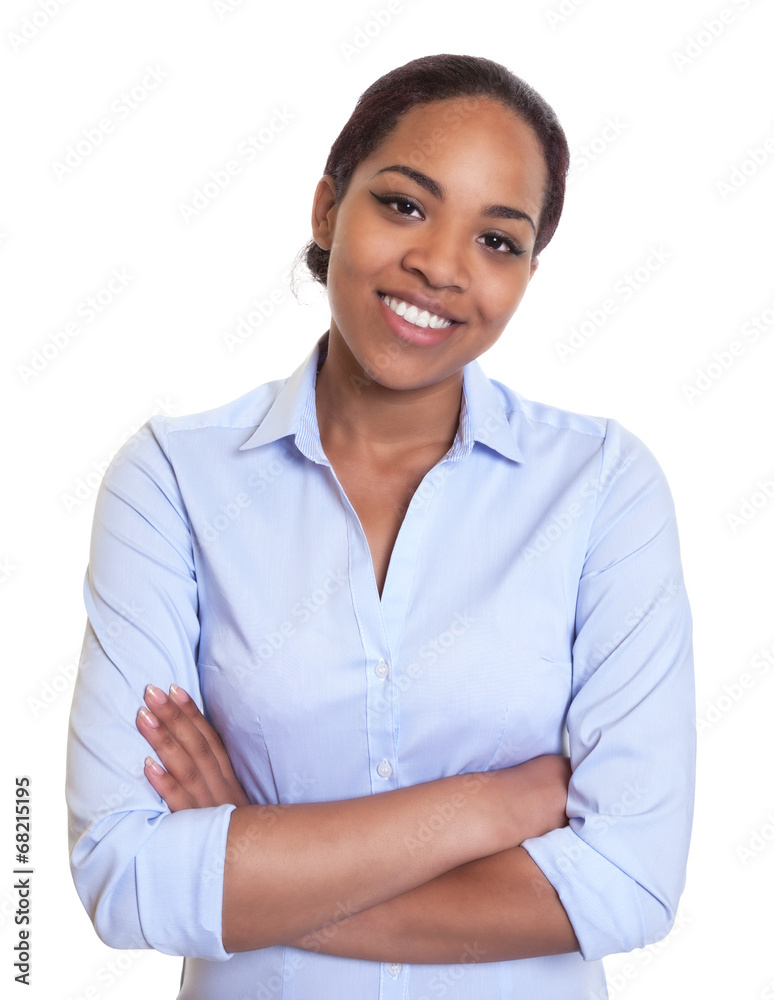 Laughing african woman in a blue shirt with crossed arms Laughing african woman in a blue shirt with crossed arms