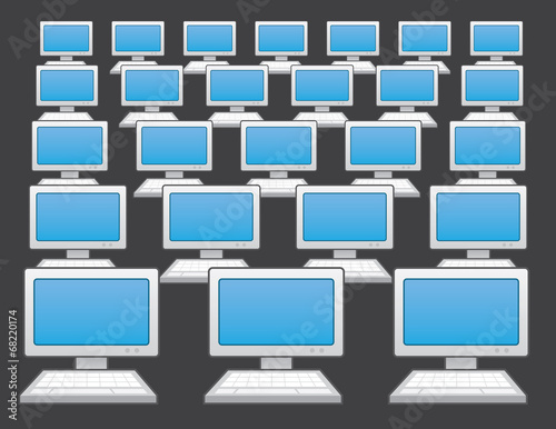 Multiple desktop computers with dark gray background