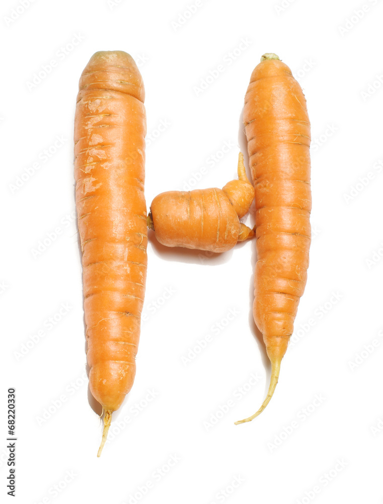 Alphabet letter H arranged from fresh carrots isolated