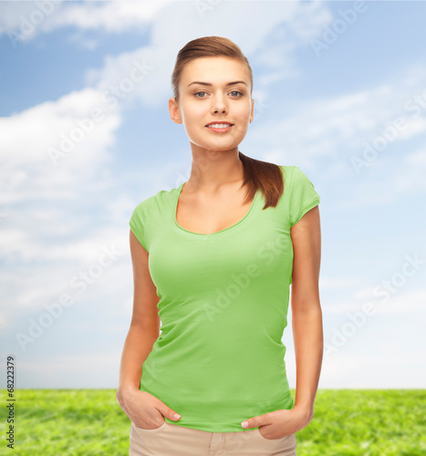 smiling young woman in blank green t-shirt