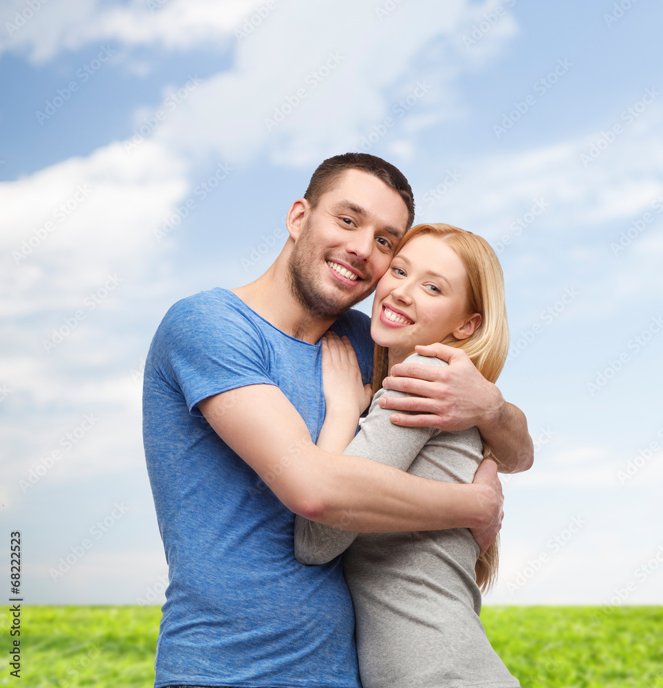 smiling couple hugging smiling couple hugging