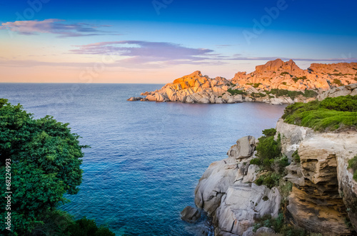 Ocean rocky coastline colorful sunset view, Sardinia