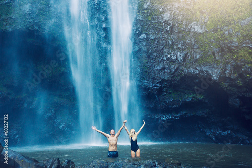 Couple under waterfall