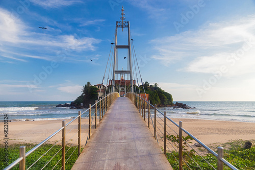 Bild auf Leinwand Suspension bridge connecting Pigeon Island, also called Parevi Doowa in Matara,