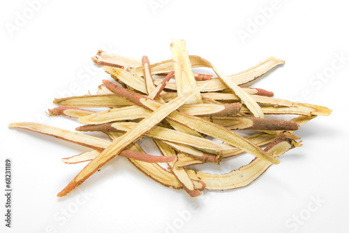 Slice liquorice roots on white background