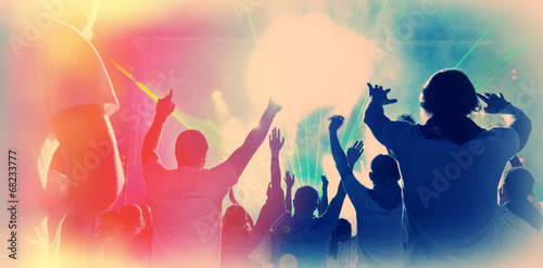 Illumination and Silhouettes of People with Raised Hands in the Night During a Night Concert. Web Banner. Dj Banner