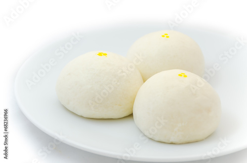 Three Chinese steamed buns isolated on white background © PeoGeo