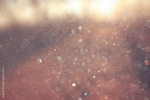 abstract photo of light burst and glitter bokeh lights. image is photo