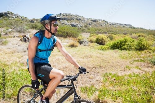 Fit cyclist riding in the countryside