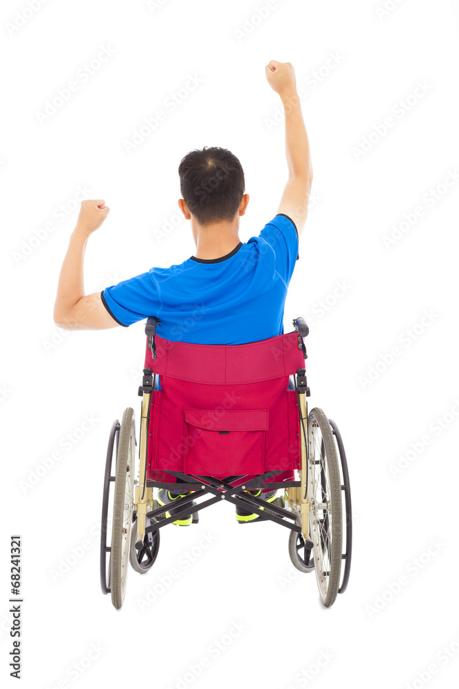 handicapped man sitting on a wheelchair and fist pose handicapped man sitting on a wheelchair and fist pose