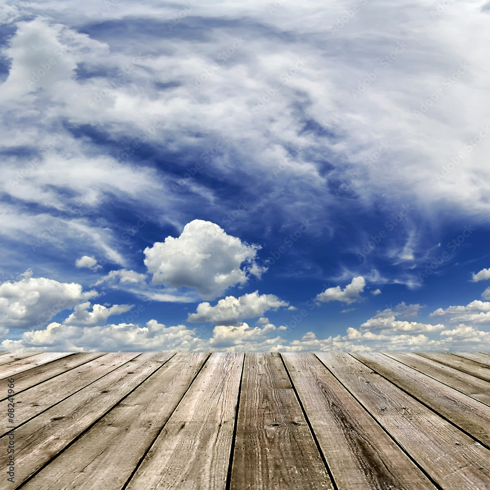 wooden floor and sky with clouds
