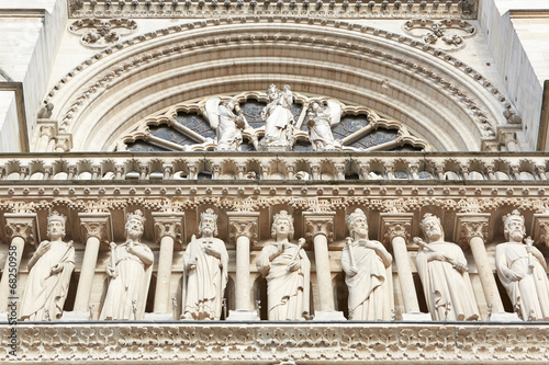 Notre Dame de Paris cathedral facade with statues