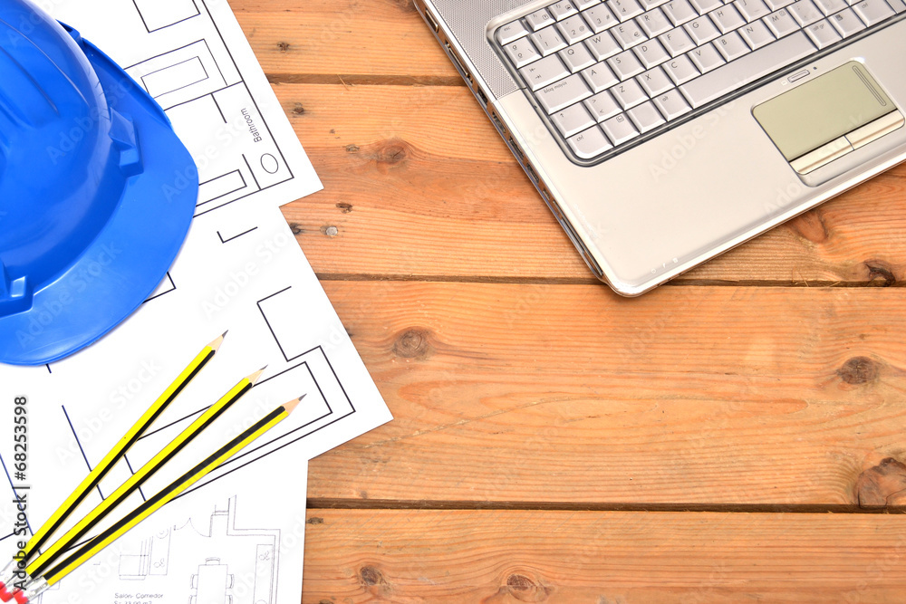 Fototapeta premium Helmet and tools for construction drawings