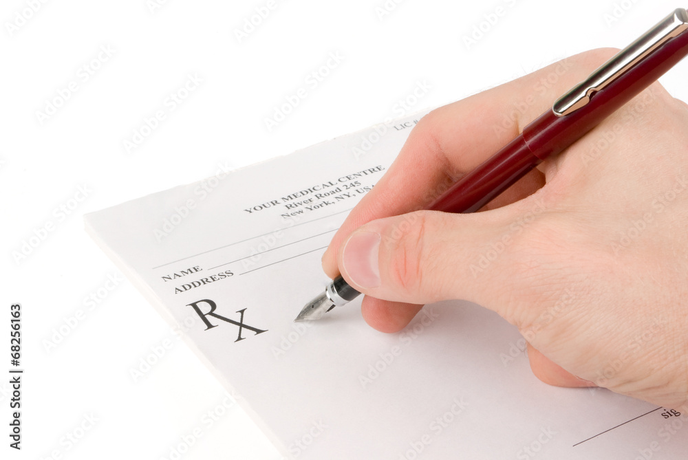 Doctor filling in empty medical prescription Doctor filling in empty medical prescription