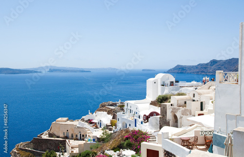 Oia with white and blue painted houses on the island of Thera.