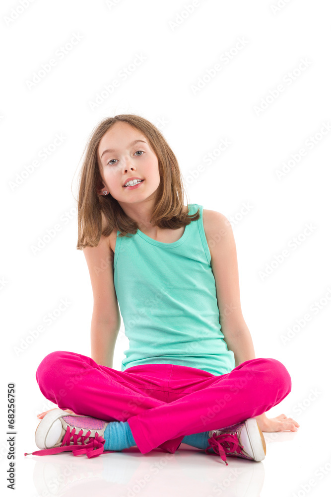 Girl sitting on the floor with legs crossed. Girl sitting on the floor with legs crossed.
