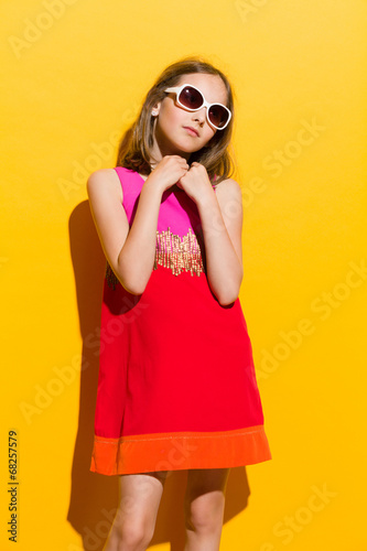 Little girl posing with hands on chest © studioloco
