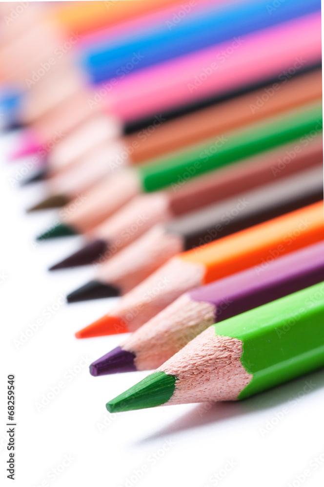 Color pencils on white background. Bokeh. Color pencils on white background. Bokeh.