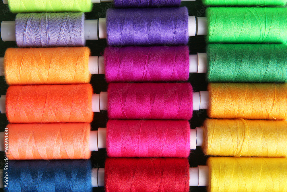 Multicolor sewing threads background Multicolor sewing threads background