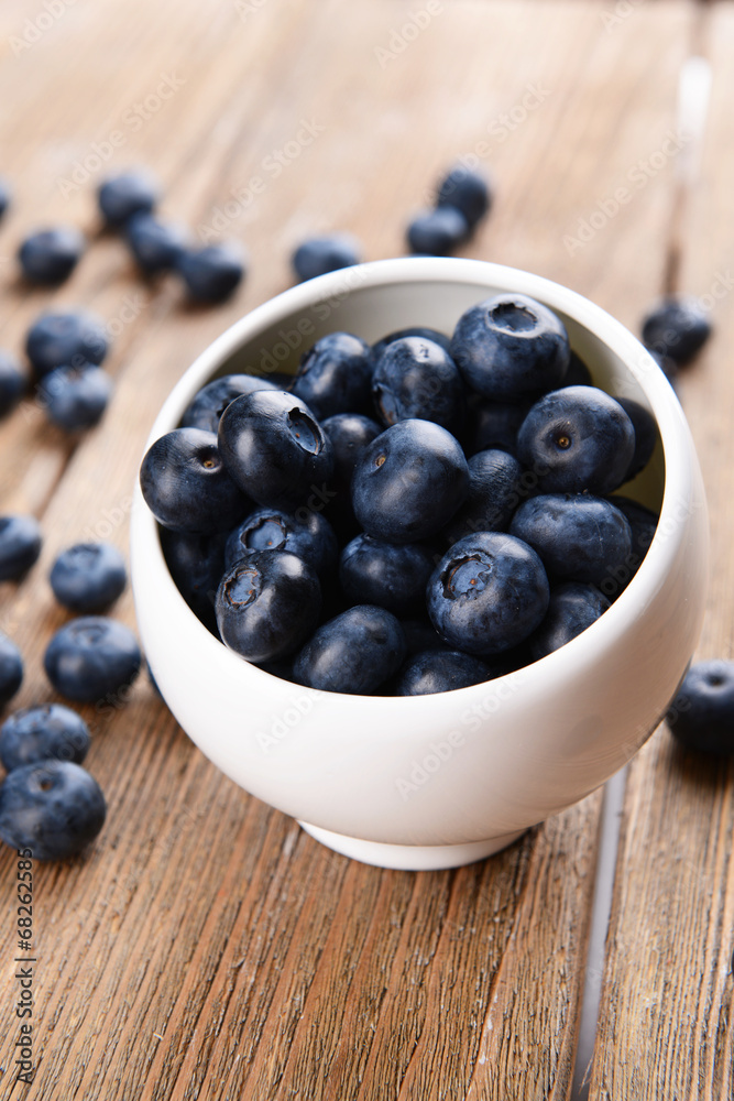Delicious blueberries in bowl on table close-up Delicious blueberries in bowl on table close-up