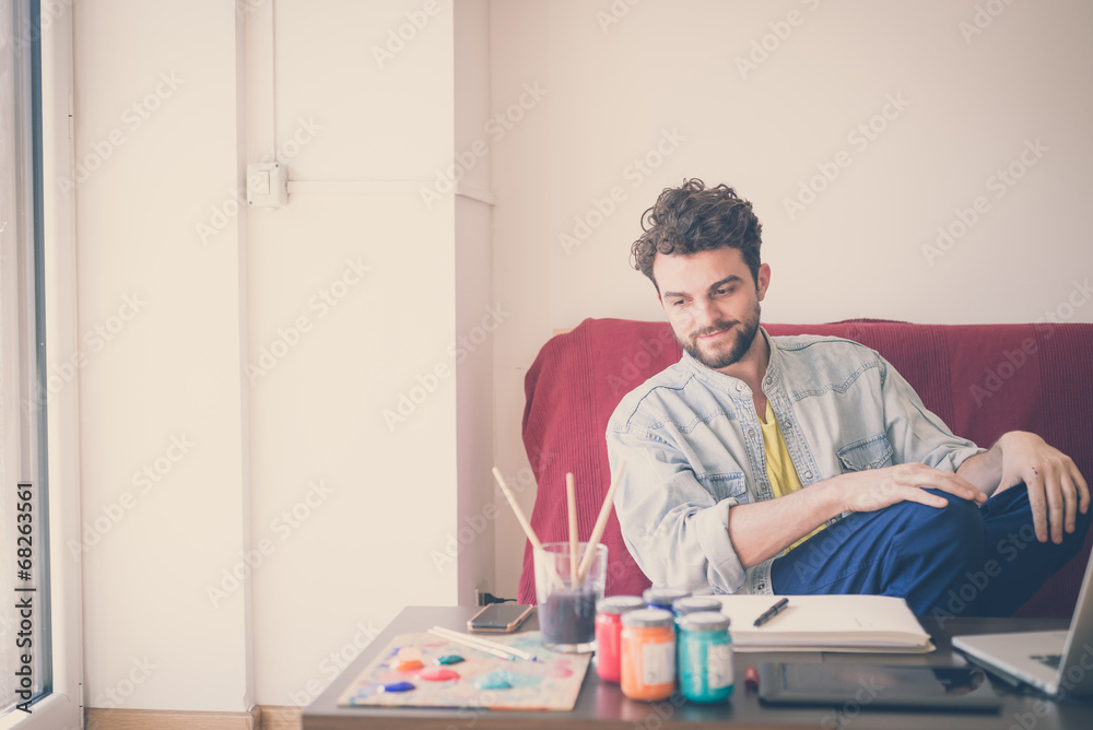 handsome hipster modern man painting