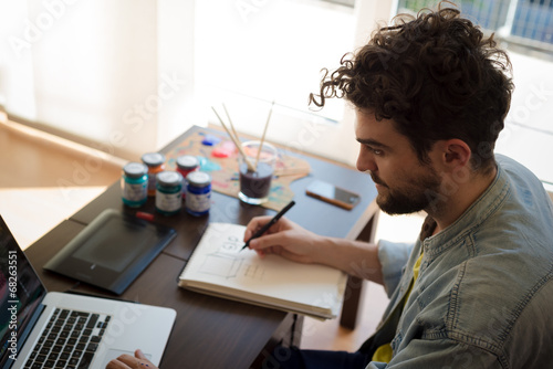 Принти на полотні handsome hipster modern man working home using laptop