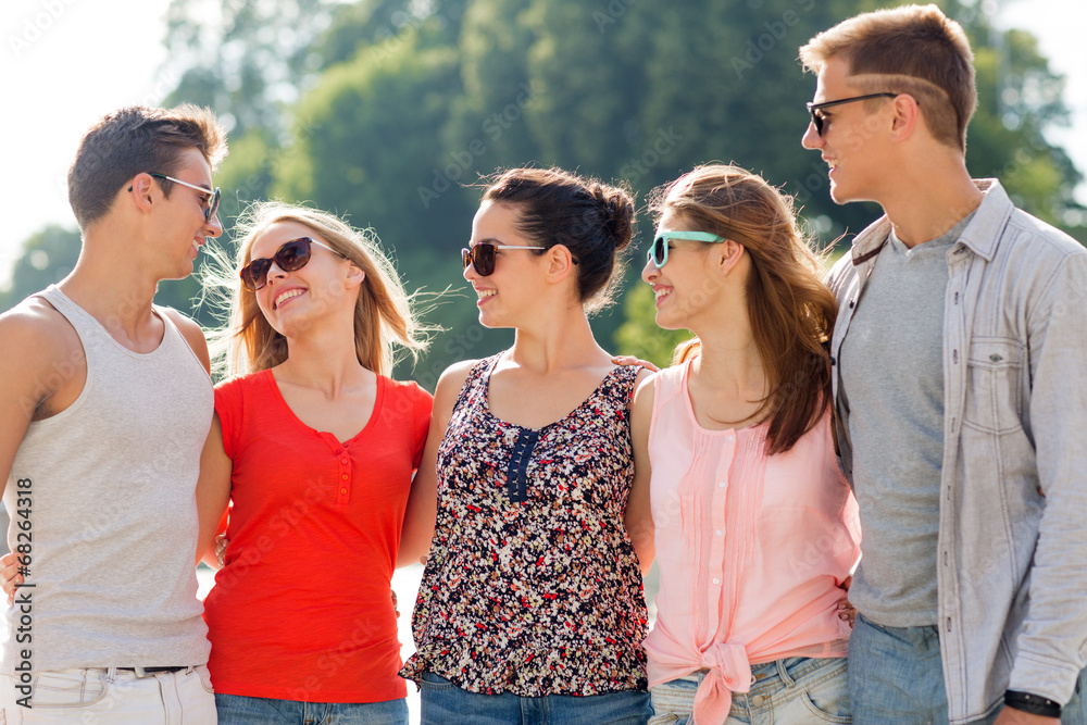 group of smiling friends in city group of smiling friends in city