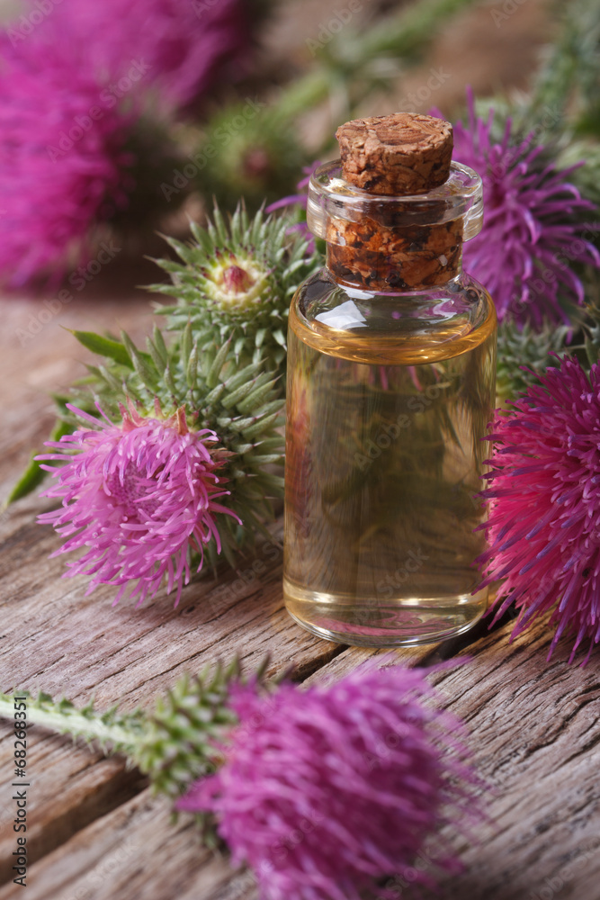 burdock oil in a glass bottle macro vertical burdock oil in a glass bottle macro vertical