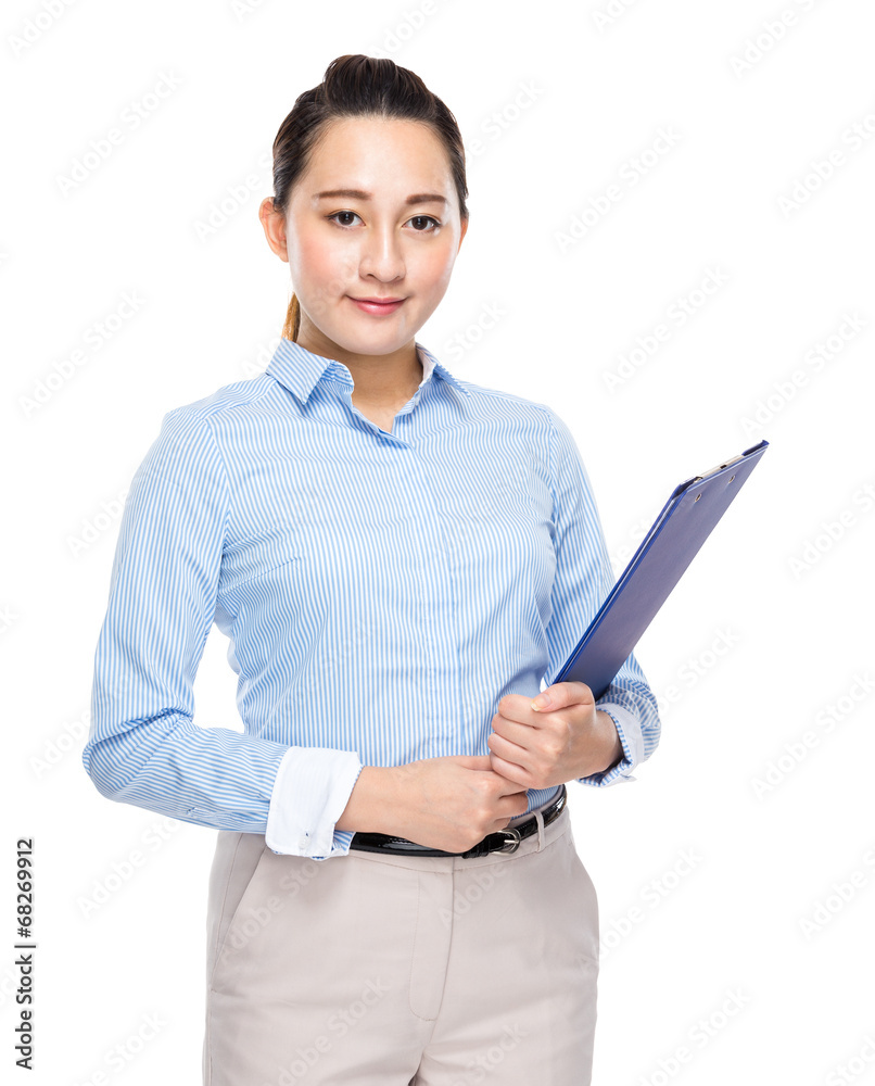 Mixed race indonesian businesswoman with clipboard Mixed race indonesian businesswoman with clipboard