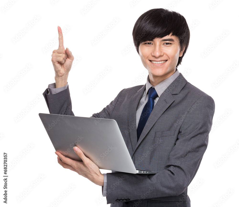 Businessman hold with laptop and finger up Businessman hold with laptop and finger up