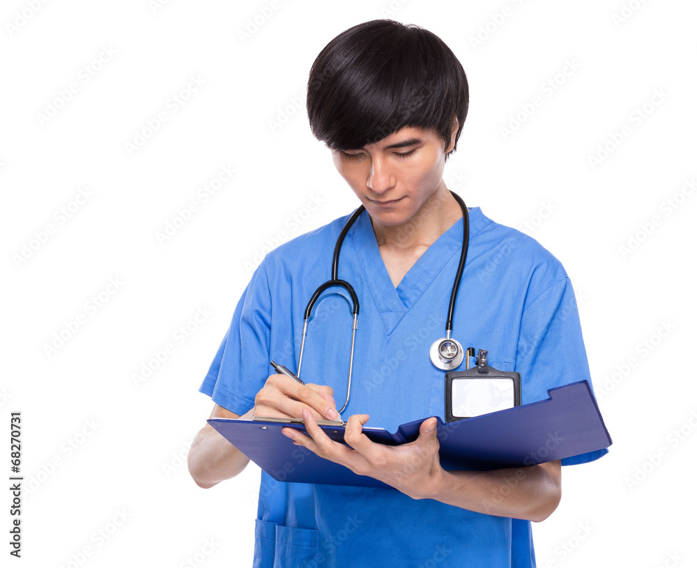 Asian doctor take note on clipboard Asian doctor take note on clipboard