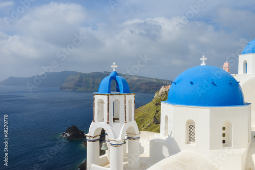 Classic Santorini scene with famous blue dome churches