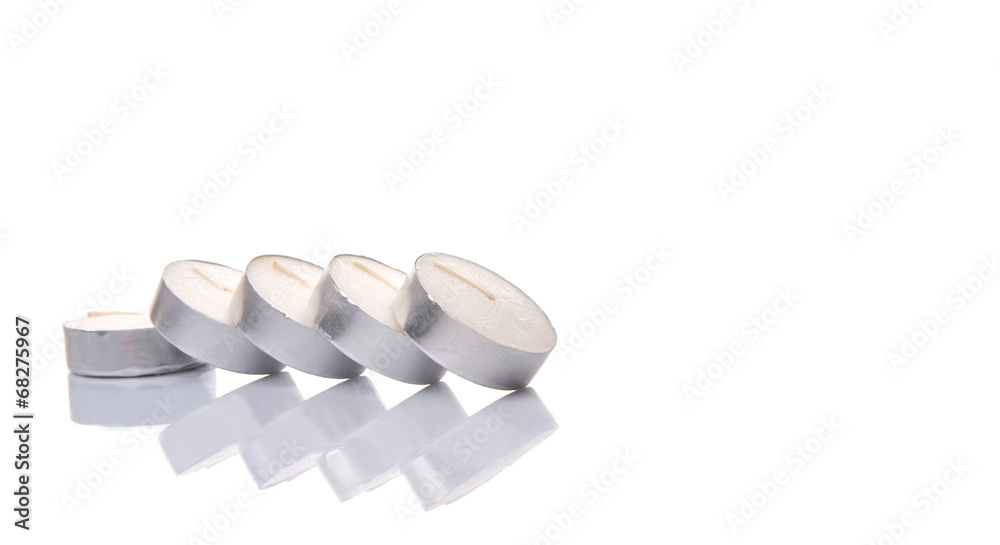 Small tealights over white background Small tealights over white background