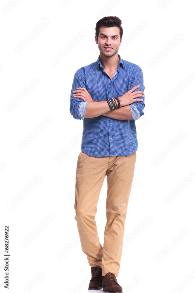 young casual man with hands crossed smiling young casual man with hands crossed smiling