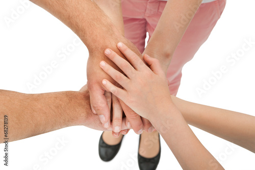 Cropped Image Of Family Stacking Hands