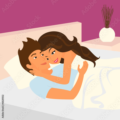Happy couple relaxing in bed