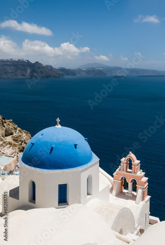 Church with cross and bells in village Oia in Santorini  Greece