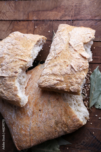 Fresh baked bread on wooden background