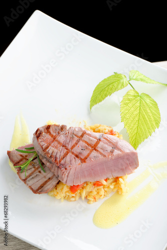 Fine dining / Medium rare sashimi tuna steak on saffron risotto